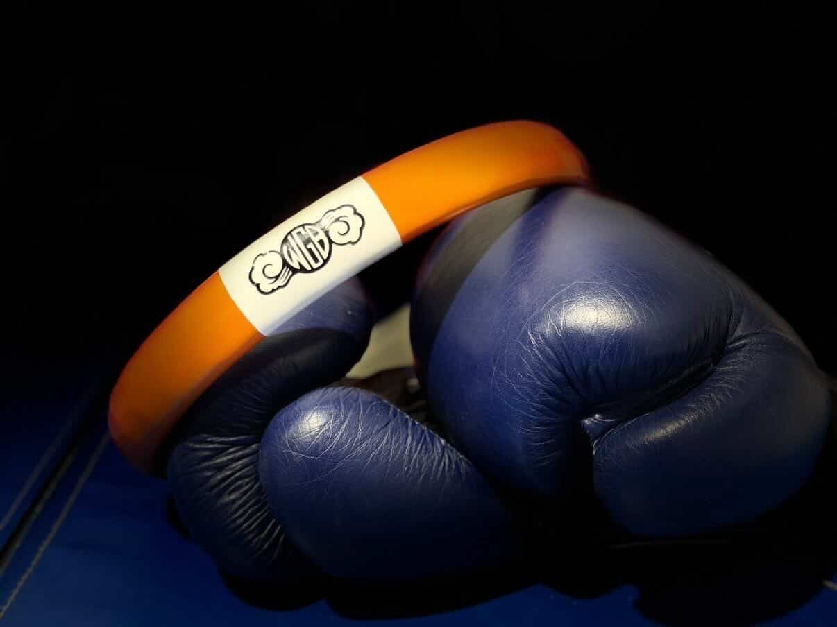 Orange, white, and black kami battle ring